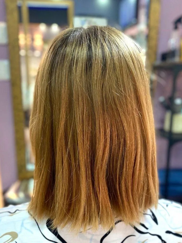 The same bob before toning: orange tones and light strands