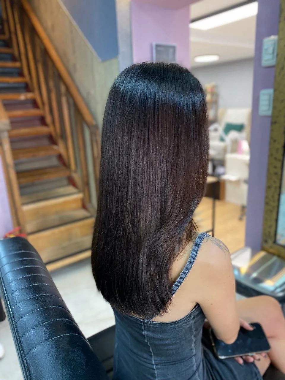 Long straight hair in dark chocolate, seen from behind